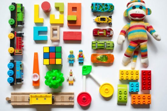 Different Types of Children Toys Stacked on the Floor